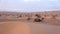 Camels among the dunes in the Sahara Desert