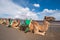 Camels resting in volcanic landscape in Timanfaya national park