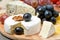 Camembert, blue cheese, grapes and walnuts, close-up, horizontal