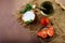 Camembert or brie cheese circle, decorated with basil and pieces of tomatoes, spice dish, on old ragged fabric, top view image wit