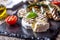 Camembert cheese. Grilled camembert cheese with zucchini tomatoes olive oil and basil leaves