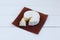 Camembert cheese traditional Normandy French gourmet round dairy product delicious food on rustic parchment on white background..