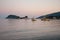 Cameo Island and Agios Sostis port at dusk