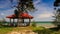 Camera Approaches Red Roof Pavilion and Azure Sea Beach