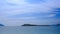 camera approaches to island boat motion of clouds in sky