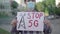 Camera approaches to Stop 5G placard in hands of Caucasian man in face mask. Male activist protesting against