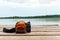 Camera and backpack on wooden dock