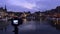 The camera captures the port of Honfleur in Normandy at blue hour