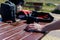 Camera cases and a video camera on a wooden table