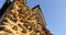 Camera crane shot of irregularly shaped stone wall of stone medieval castle