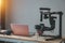 Camera DSLR professional Gimbal stabilizer production and laptopon the table gear of Vlog
