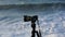 Camera filming huge waves hitting the cliff and exploding