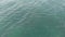 The camera flies forward. Top-down view of the sea waves. Sea ripples. Aerial view. The background of the sea. The