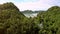 Camera Flies over Large Mountain and Shows Buddhist Temple