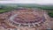 Camera is flying over huge modern sportive olympic stadium under construction