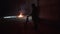 Camera man shoots a big fire in dark abandoned military hangar.