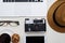Camera in the middle and frame of laptop, eyeglasses, hat, phone