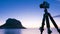 Camera and Monemvasia island at sunrise