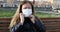 Camera movement . woman putting a protective mask against the virus corona