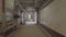 Camera moves along the basement corridor , along the walls are pipes and communications