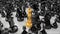 camera moves over the crowd of different black chess pieces and focuses on the Golden