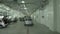 Camera Moves Over Grey Car Driving along Service Station