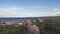 The camera moves the trees and flowers growing on the stony coast of the Gulf of Finland