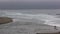 Camera Pan Ocean Waves On Northern California Beach With Distant View Of Couple