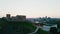 The camera pans up from below with a view of Gediminas Tower and the center of Vilnius at sunset