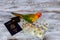 camera passport and parrot money for vacations on sea star wood background