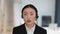 Camera pov portrait of professional young asian woman support center operator wearing headset talking to customer