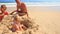 Camera Removes from Grandpa Kids Play among Sand Heap on Beach