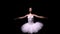 Camera rotates around gentle ballerina in a white tutu performing graceful movements with her hands. Orbital shot of a