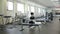 Camera Shows Spacious Light Empty Gym with Trainers