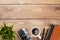 Camera and supplies on office wooden desk