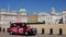 Camera tracks London taxi in front of Horse Guards Parade