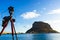 Camera on tripod and Monemvasia island