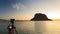 Camera on tripod and Monemvasia island sunrise