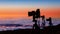 Camera tripods photographer sunset sea of clouds