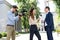 cameraman and female newscaster interviewing businessman