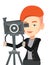 Cameraman with movie camera on tripod.