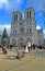 Cameraman near Notre-Dame Cathedral AKA Cathedral Notre Dame de Paris with decorated pine-tree in Paris, France,