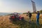 cameraman recording a young couple enjoying a buggy car ride up a mountain