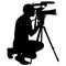 Cameraman with video camera. Silhouettes on white background