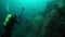 Cameramen scuba diver with group under water in Lake Baikal.