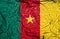 Cameroon vintage flag on old crumpled paper background