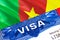 Cameroon Visa in passport. USA immigration Visa for Cameroon citizens focusing on word VISA. Travel Cameroon visa in national