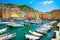 Camogli marina harbor, boats and typical colorful houses. Ligury, Italy