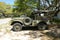 Camouflage Jeep Parked in a Driveway