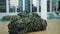 camouflage net. military. netting. protective camouflage nets, made of green ribbons and khaki fabric shreds, for the